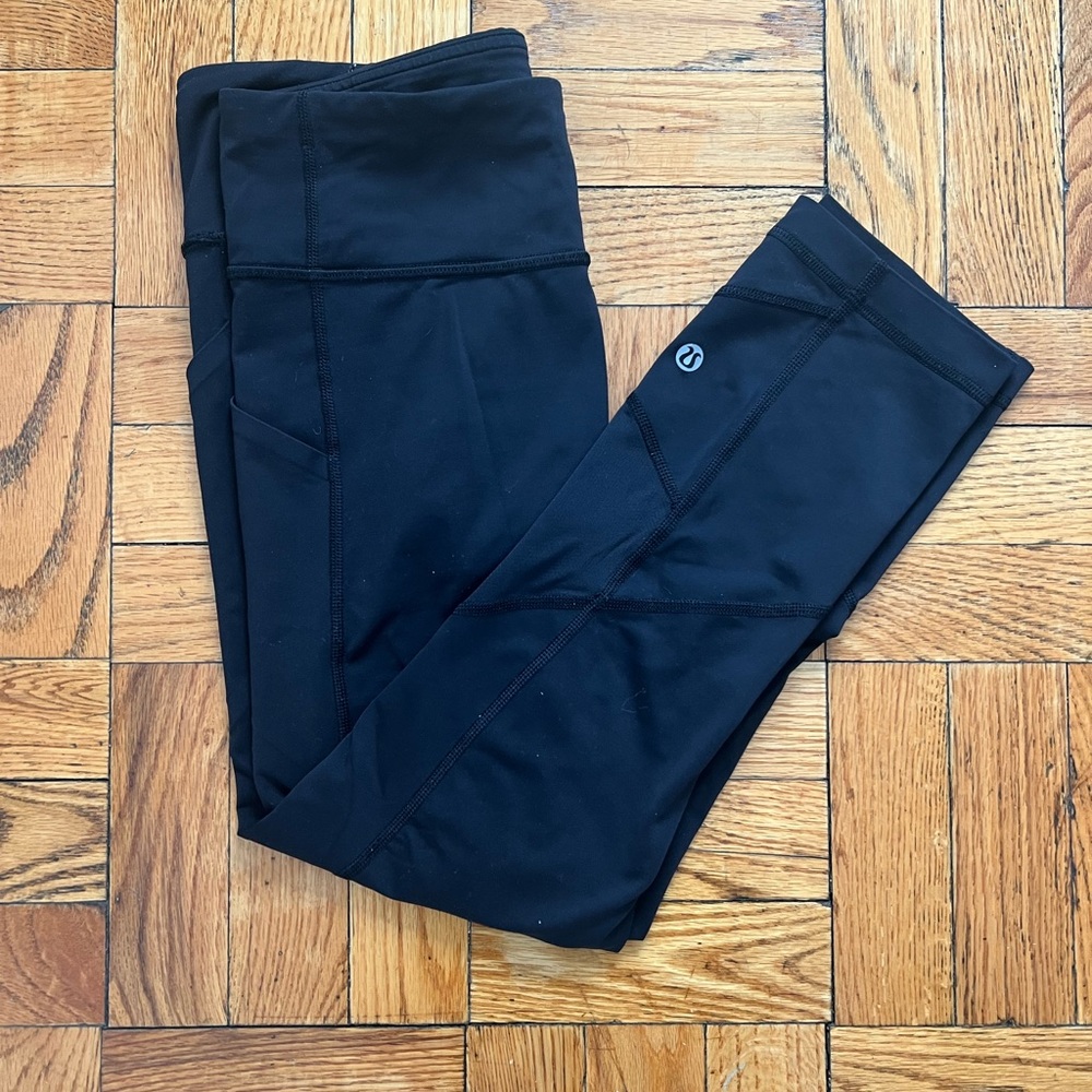 Black Lululemon leggings/running tights with mesh paneling, size 6
